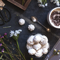 Flowers, coffee and marshmallow cookies