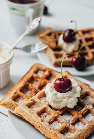 Waffles with whipped cream and cherry
