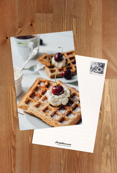 Waffles with whipped cream and cherry