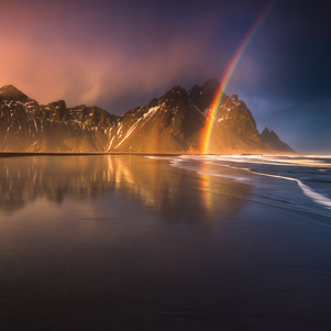 Stokness beach with a rainbow