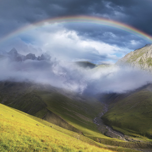 Rainbow in the mountain valley