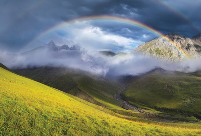 Rainbow in the mountain valley