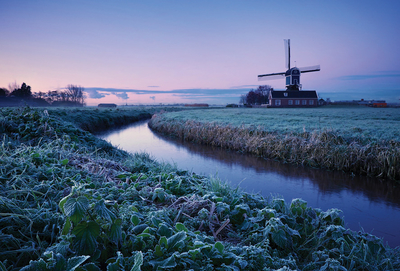 Winter landscape with a windmill