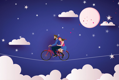 Couple on a bicycle at night