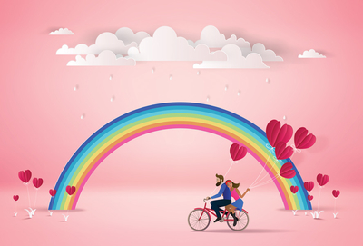 Couple on a bicycle and the rainbow