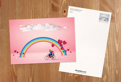 Couple on a bicycle and the rainbow
