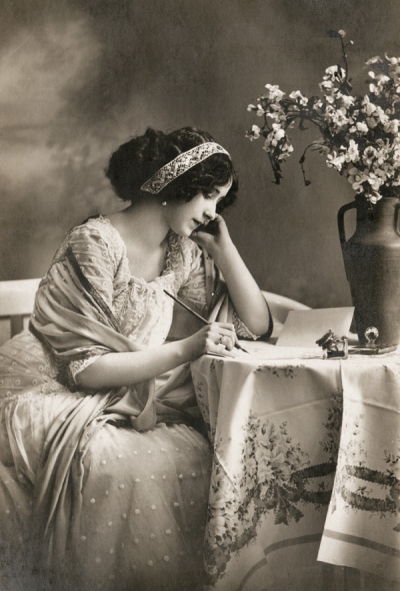A lady writing a letter
