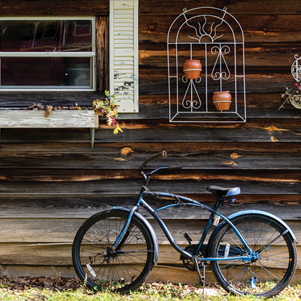 Bicycle and old wooden house