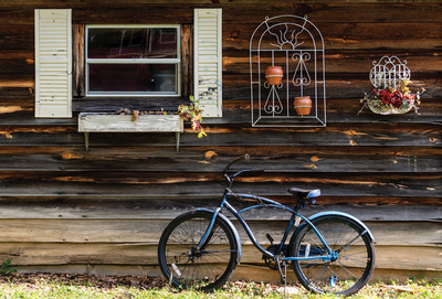 Bicycle and old wooden house