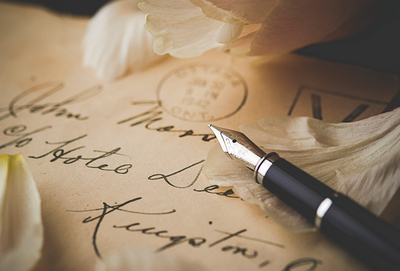 Old postcards and a pen
