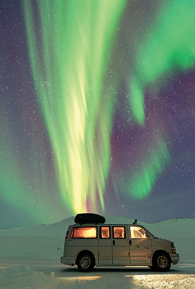 Van under the aurora borealis