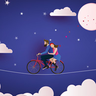 Couple on a bicycle at night