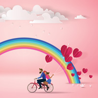 Couple on a bicycle and the rainbow